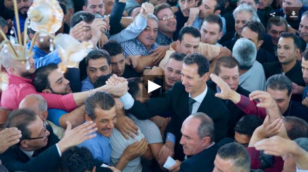 Assad greets his supporters during Eid al-Adha prayers_video