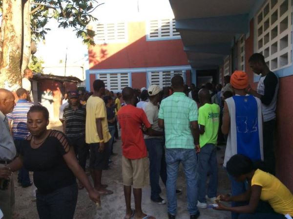 in Port-Au-Prince where young men are preventing the vote from happening