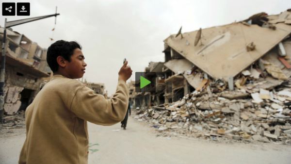 BoyPhotographsDamagedBuildings-inPalmyra_video